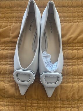 C. Paraviano Cream Pointed Toe Flats with Crystal Buckle